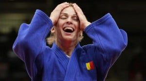 Romania's Alina Dumitru celebrates after defeating Japan's Tomoko Fukumi in women's -48kg semi-final A judo match at London 2012 Olympic Games