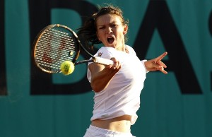 Simona Halep of Romania plays a shot during her match against Samantha Stosur of Australia at the French Open tennis tournament at Roland Garros in Paris